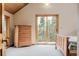 Spacious main bedroom features vaulted wood ceiling and exterior door to private deck at 3581 Gap Rd, Golden, CO 80403