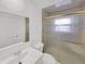 Bathroom featuring vanity, toilet and shower with sliding glass door at 11769 Clayton St, Thornton, CO 80233