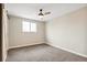 Spacious bedroom with carpeted floor and a barn door at 4336 Decatur St, Denver, CO 80211