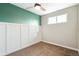 Bedroom with green accent wall and white board batten at 4336 Decatur St, Denver, CO 80211