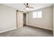Bright bedroom with carpeted floor and a barn door at 4336 Decatur St, Denver, CO 80211