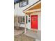 Red front door with wood covered entryway at 4336 Decatur St, Denver, CO 80211