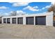 Four-car garage with dark gray doors at 4336 Decatur St, Denver, CO 80211
