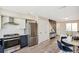 Modern kitchen with stainless steel appliances and navy blue cabinets at 4336 Decatur St, Denver, CO 80211