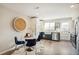 Modern kitchen with white and dark blue cabinets and stainless steel appliances at 4336 Decatur St, Denver, CO 80211