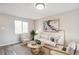Cozy living room with a light beige sofa and two armchairs at 4336 Decatur St, Denver, CO 80211