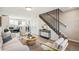 Living room showcasing a modern staircase and comfortable seating at 4336 Decatur St, Denver, CO 80211