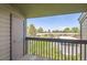 Private balcony overlooking mature trees and the complex at 3558 S Depew St # 302, Denver, CO 80235