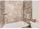 Bathroom featuring a tiled shower and a jacuzzi tub at 3558 S Depew St # 302, Denver, CO 80235