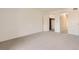 Carpeted bedroom with an open closet and neutral wall color at 3558 S Depew St # 302, Denver, CO 80235