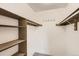 Spacious walk-in closet with rods and shelving at 3558 S Depew St # 302, Denver, CO 80235