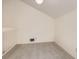 Bright room with sloped ceiling, neutral walls, and gray carpet at 3558 S Depew St # 302, Denver, CO 80235