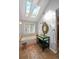 Bathroom featuring unique sink, mirror, skylight, tub, and tile floors at 1502 Columbine Ave, Boulder, CO 80302