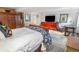 Large bedroom featuring a vibrant red dresser, desk, and a serene sitting area at 1502 Columbine Ave, Boulder, CO 80302