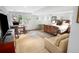 Spacious bedroom with a cozy seating area, desk, and walkout access to a patio at 1502 Columbine Ave, Boulder, CO 80302