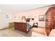 A well-lit bedroom with decorative lamps, art and a large sleigh bed flanked by antique-looking furnishings at 1502 Columbine Ave, Boulder, CO 80302
