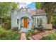 Charming home with light blue siding, arched entryway, and lovely landscaping at 1502 Columbine Ave, Boulder, CO 80302