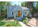 Charming blue two-story home with beautiful landscaping and inviting front porch at 1502 Columbine Ave, Boulder, CO 80302