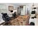 Open-concept living space featuring a work area, mini-kitchenette, and ample natural light at 1502 Columbine Ave, Boulder, CO 80302
