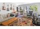 Comfortable living room with guitars on the wall, a cozy couch and an adjacent study space at 1502 Columbine Ave, Boulder, CO 80302