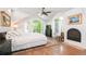 Bright and airy main bedroom with vaulted ceilings, fireplace, and balcony access at 1502 Columbine Ave, Boulder, CO 80302