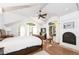 Main bedroom featuring a fireplace, lots of light, vaulted ceiling, and hardwood floors at 1502 Columbine Ave, Boulder, CO 80302