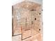 Modern glass enclosed shower with rain shower head, built-in bench, and decorative tile at 1502 Columbine Ave, Boulder, CO 80302