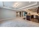Finished basement with bar, wine rack, carpet and neutral paint at 24288 E Brandt Ave, Aurora, CO 80016