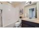 Full bathroom with tub, shower, vanity, and medicine cabinet at 24288 E Brandt Ave, Aurora, CO 80016