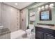 Modern bathroom featuring tiled walk-in shower, granite counters, and stylish vanity at 24288 E Brandt Ave, Aurora, CO 80016