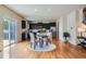 Bright dining area seamlessly connecting to a kitchen with modern appliances and granite countertops at 24288 E Brandt Ave, Aurora, CO 80016