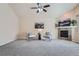 Spacious living room with a fireplace, high ceilings, and comfortable seating area with a ceiling fan at 24288 E Brandt Ave, Aurora, CO 80016