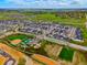 High-angle view of a neighborhood featuring modern homes and extensive community amenities and open spaces at 5737 Amarosa Dr, Parker, CO 80134