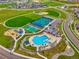 Panoramic aerial showcasing community amenities with pool, tennis, playground and baseball park at 5737 Amarosa Dr, Parker, CO 80134