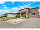 Well-maintained backyard with a concrete patio and gravel area at 5737 Amarosa Dr, Parker, CO 80134