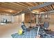 Unfinished basement area ready for customization with exercise equipment at 5737 Amarosa Dr, Parker, CO 80134