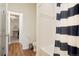 Bathroom with tub, striped shower curtain, and wood-look flooring at 5737 Amarosa Dr, Parker, CO 80134