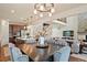 Dining room with large table and views of the living room and kitchen at 5737 Amarosa Dr, Parker, CO 80134