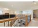 Open foyer showcasing hardwood floors, a staircase with wood railings, and a view of the living area below at 5737 Amarosa Dr, Parker, CO 80134