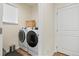 Functional laundry room equipped with modern washer and dryer, providing convenience for everyday tasks at 5737 Amarosa Dr, Parker, CO 80134