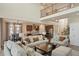 Open floor plan features living room and kitchen with large kitchen island and dining area at 5737 Amarosa Dr, Parker, CO 80134