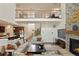 Spacious living room with high ceilings and stone fireplace open to the kitchen at 5737 Amarosa Dr, Parker, CO 80134