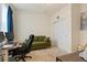 Bright office with a green sofa and closet at 5737 Amarosa Dr, Parker, CO 80134