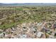Expansive aerial shot showcasing the community's layout, landscaping, and surrounding greenery at 2879 Shadow Lake Rd, Lafayette, CO 80026