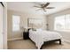 Calm bedroom with a ceiling fan, and a big window showcasing neighborhood view at 2879 Shadow Lake Rd, Lafayette, CO 80026