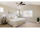 Serene bedroom with neutral tones, a large window, vaulted ceiling and a comfortable bed at 2879 Shadow Lake Rd, Lafayette, CO 80026