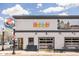 Exterior of a commercial building featuring eye catching signage, street lights, and black awnings at 2879 Shadow Lake Rd, Lafayette, CO 80026
