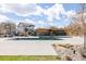 Refreshing community pool with a modern pool house, lounge chairs, and ample deck space at 2879 Shadow Lake Rd, Lafayette, CO 80026