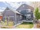 Charming two-story home with a welcoming front porch and well-manicured lawn at 2879 Shadow Lake Rd, Lafayette, CO 80026