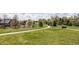 Lush green space with walking paths, flowering plants and mature trees for recreation at 2879 Shadow Lake Rd, Lafayette, CO 80026
